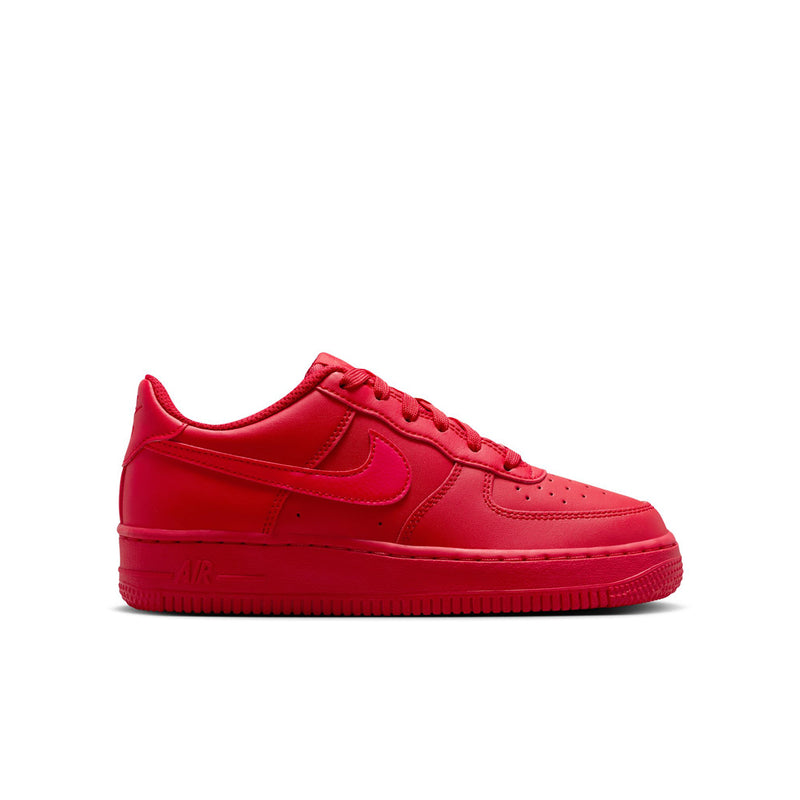 Youth red low-top lace-up sneaker with Nike swoosh and padded collar