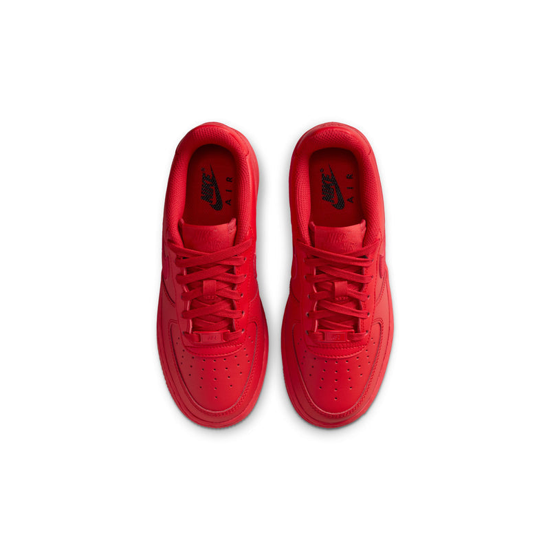 Red youth sneakers with open laces and padded tongue interior
