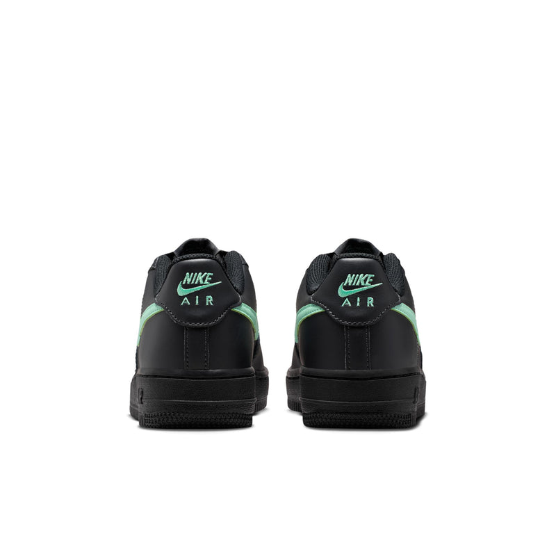 Black youth Air Force 1 sneakers with mint green heel accent and Nike Air branding.