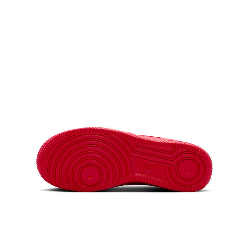 Red rubber outsole with traction tread pattern for youth sneaker