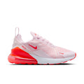 Women's light pink knit running shoe with red Air sole and Nike swoosh