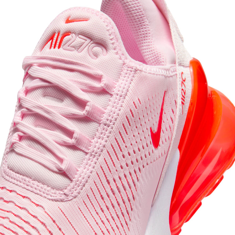 Close-up of light pink upper with laces, Nike swoosh, and 270 text detail