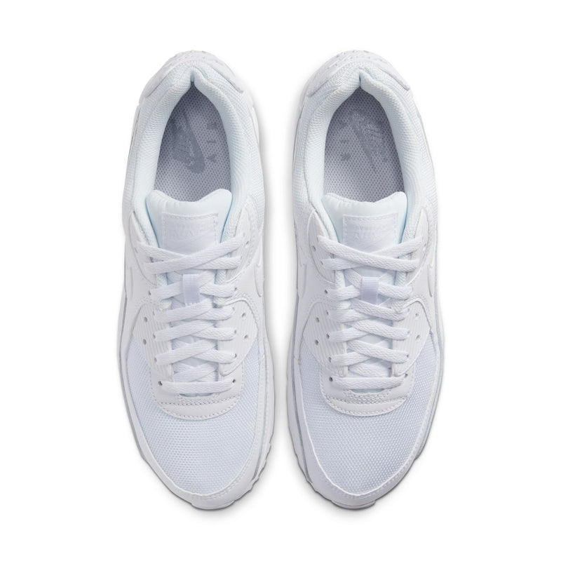 Pair of white lace-up sneakers, close front view with breathable mesh interior