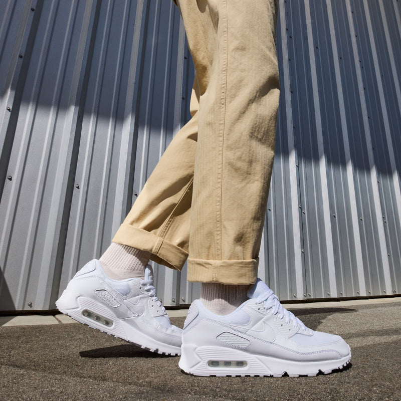 White lace-up sneakers with air window and textured rubber sole