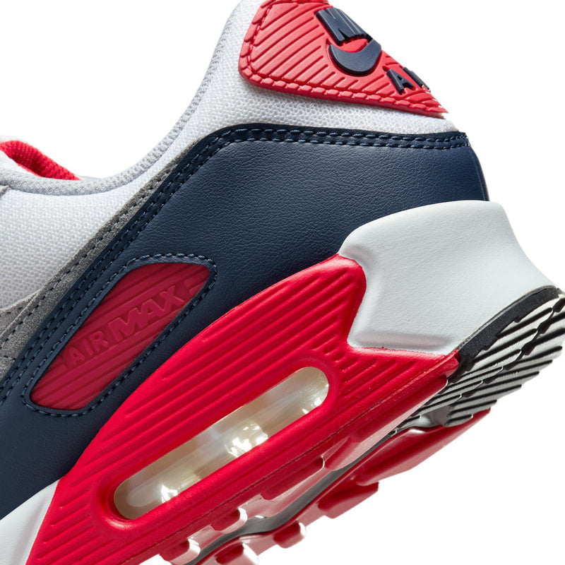 Air Max 90 quarter panel in navy leather with red midsole and visible air window