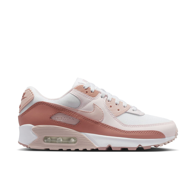 Women’s Nike Air Max 90 running shoes in white and dusty rose with visible Air unit