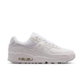 Women's white running sneakers with visible Air cushioning and lace-up front