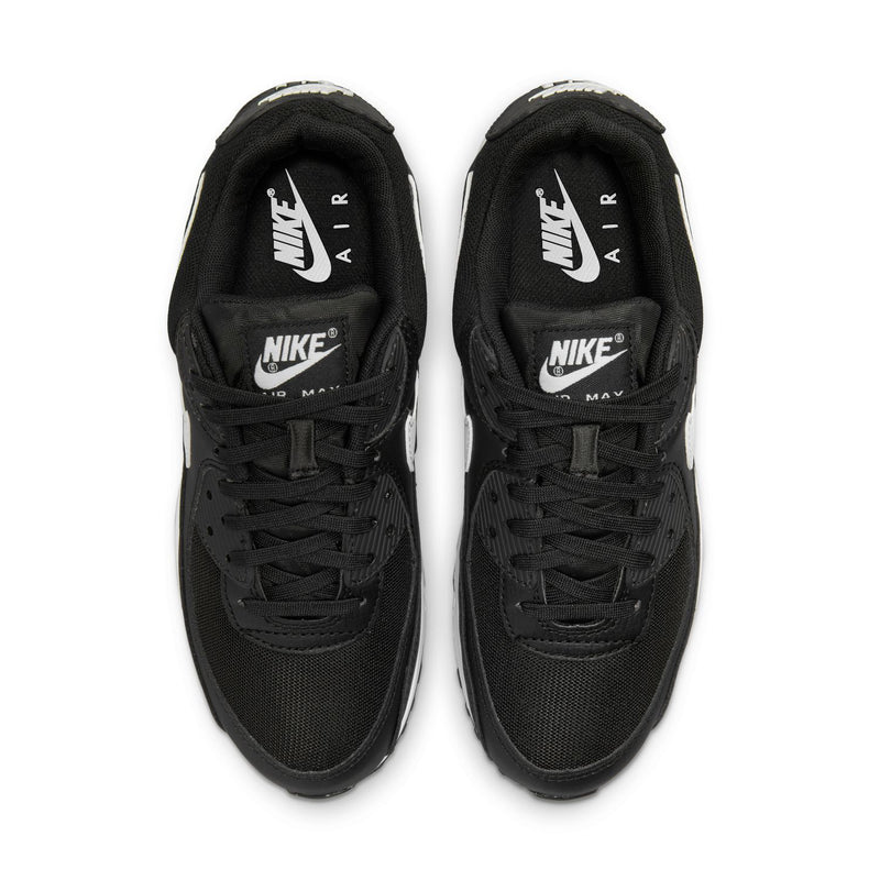 Women's Air Max 90 sneaker pair, top view of black laces with Nike Air logo on tongue.