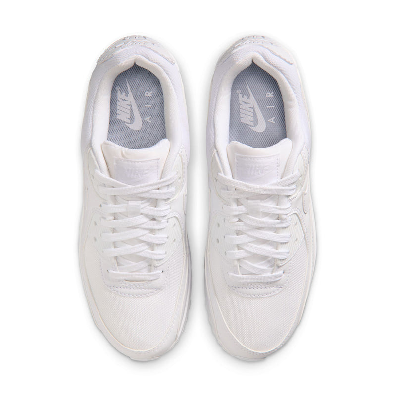 Pair of white sneakers with white laces and cushioned tongue with branding
