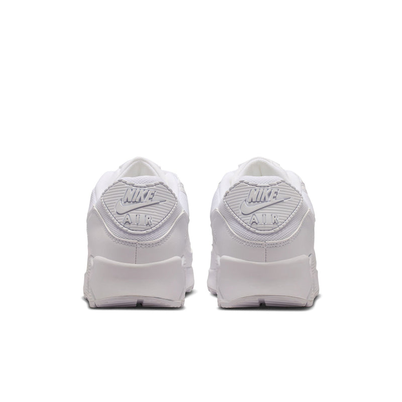 Pair of white sneakers with Air branding on the heel and lace loops