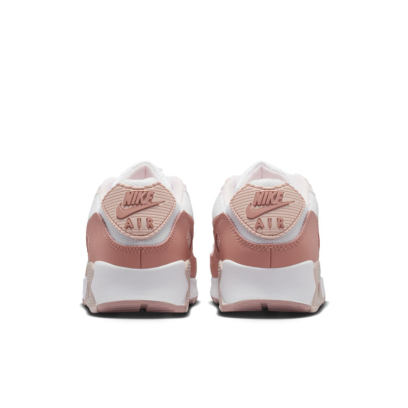 Women’s Nike Air Max 90 sneakers, rear view with Nike Air heel branding and pink accents