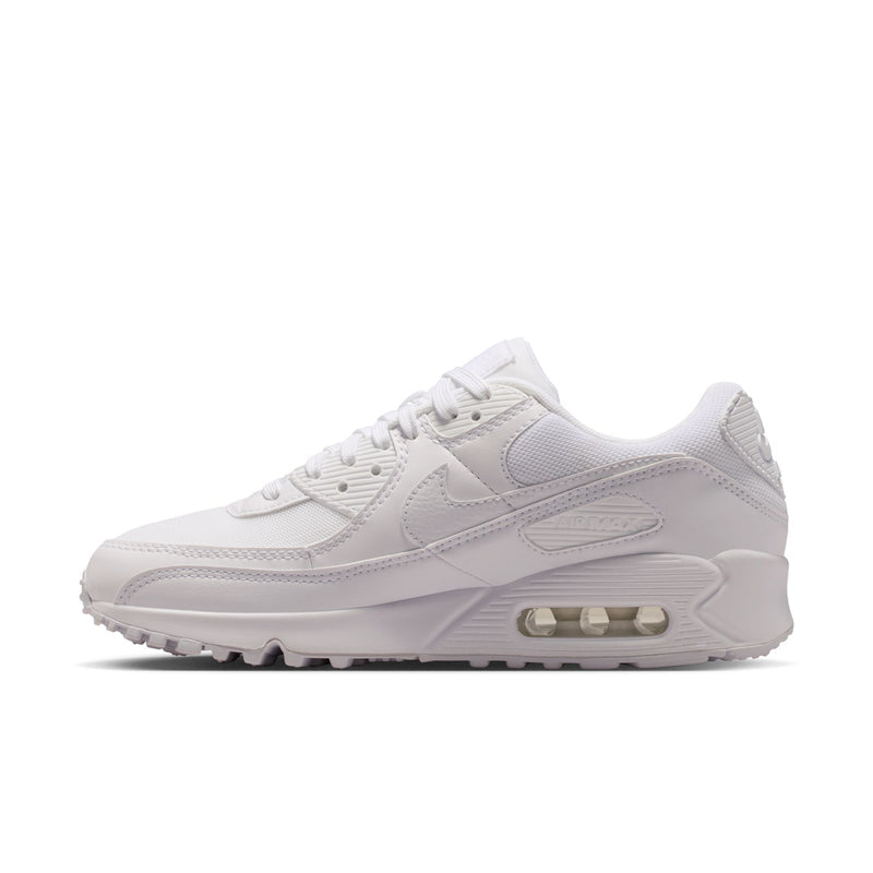 Women's white sneakers with ribbed panels, lace-up design, and Air window sole