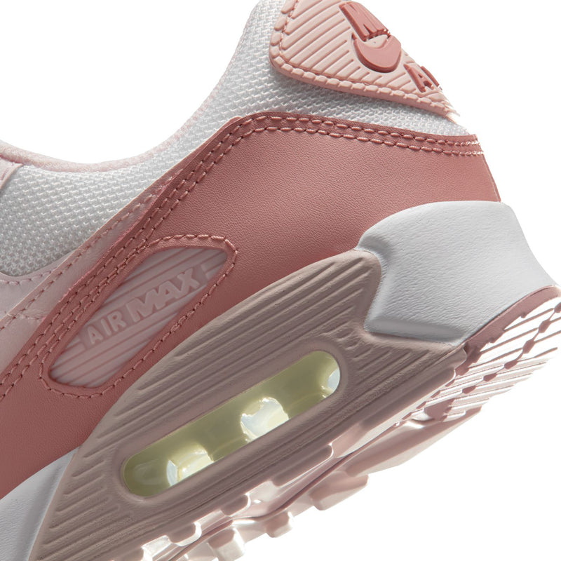 Women’s Nike Air Max 90 side detail with pink mudguard and green-tinted Air window