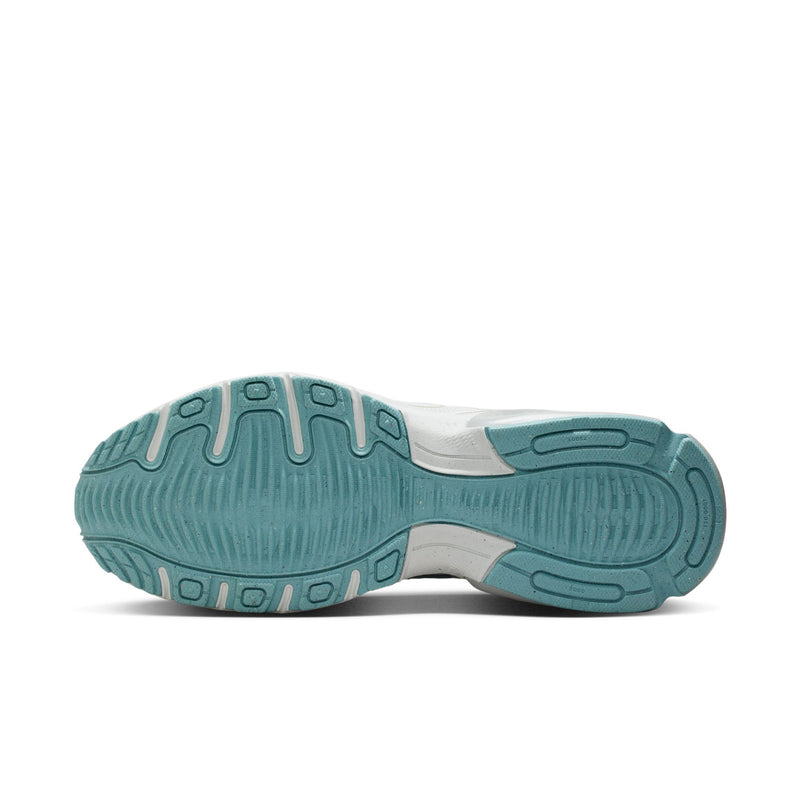 Outsole of men's gray running sneakers with teal rubber grip pods