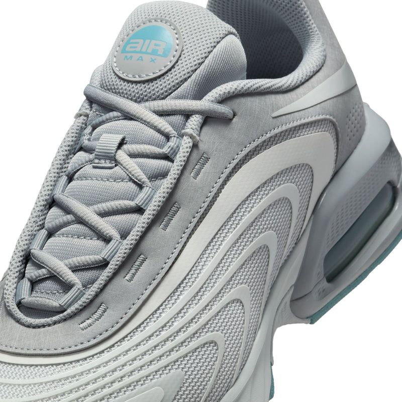 Close-up of men's gray sneaker upper with Air Max logo and lace eyelets