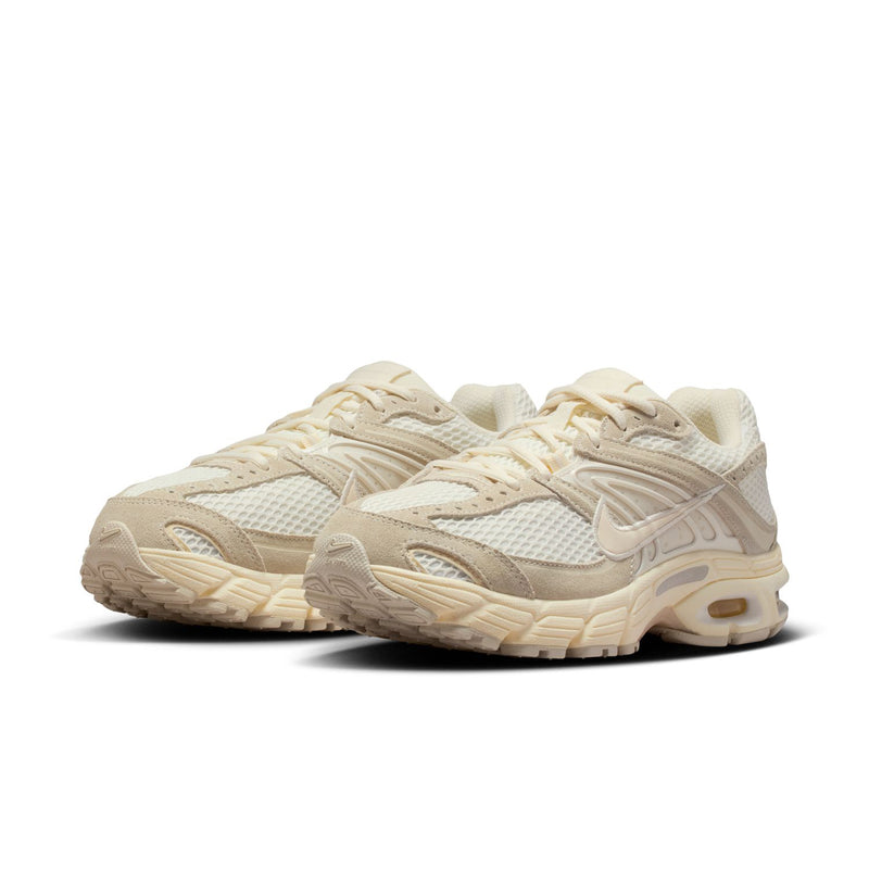 Women's beige sneakers, angled side view with layered straps and Air Max sole