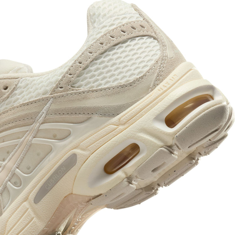 Women's beige sneaker midsole close-up, visible Air Max windows and textured tread