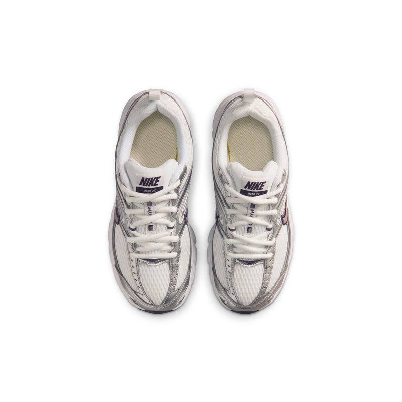 Pair of youth white sneakers with lace-up front and NIKE logo on tongue