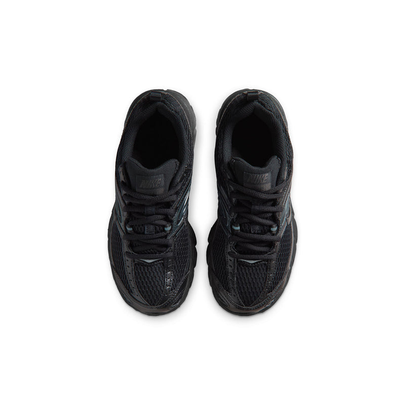 Youth black sneakers, top view of tongue and lace area