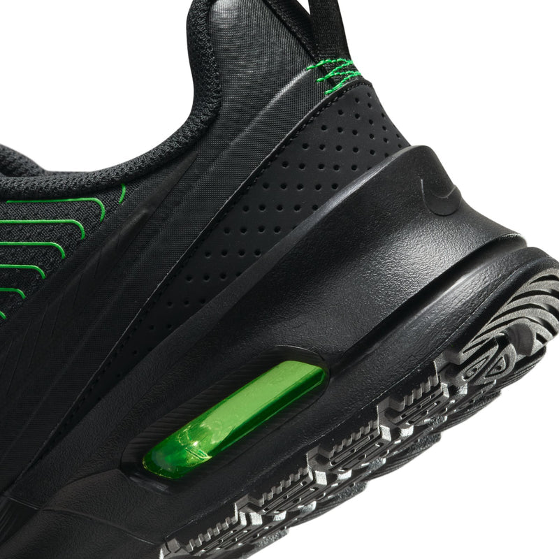 Close-up of men's black midsole with green air window and textured traction pods