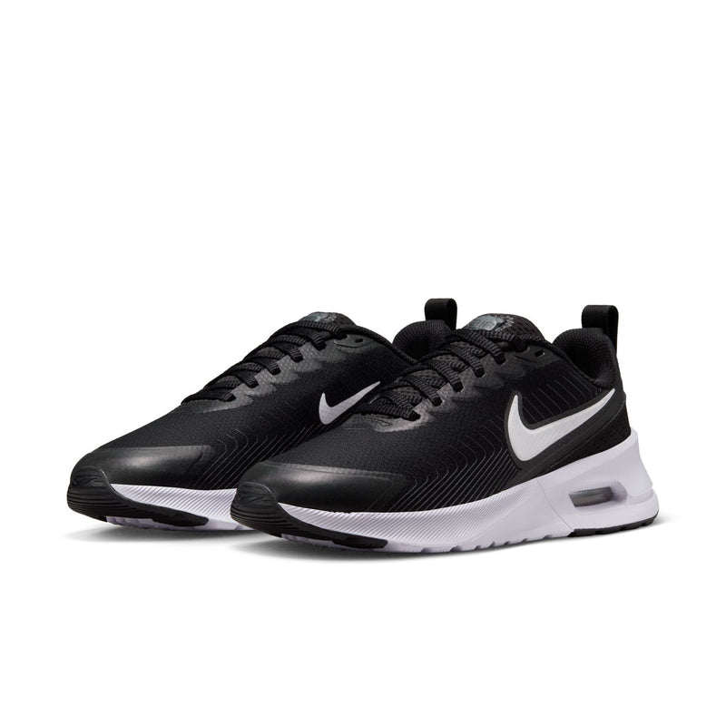 Black women's Nike sneakers with white midsole and visible Air window