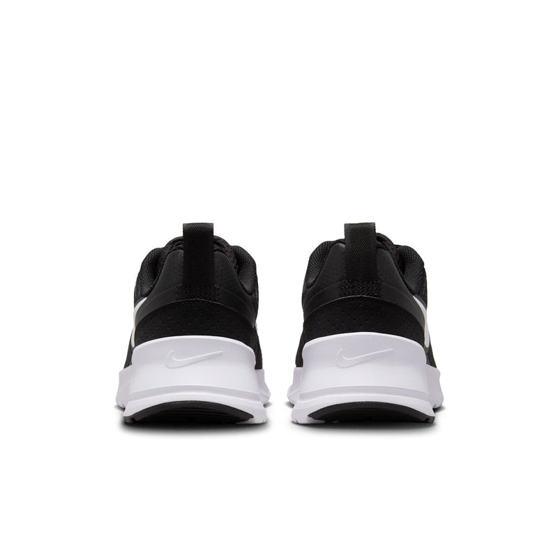 Black Nike sneakers for women, rear view with white heel panel