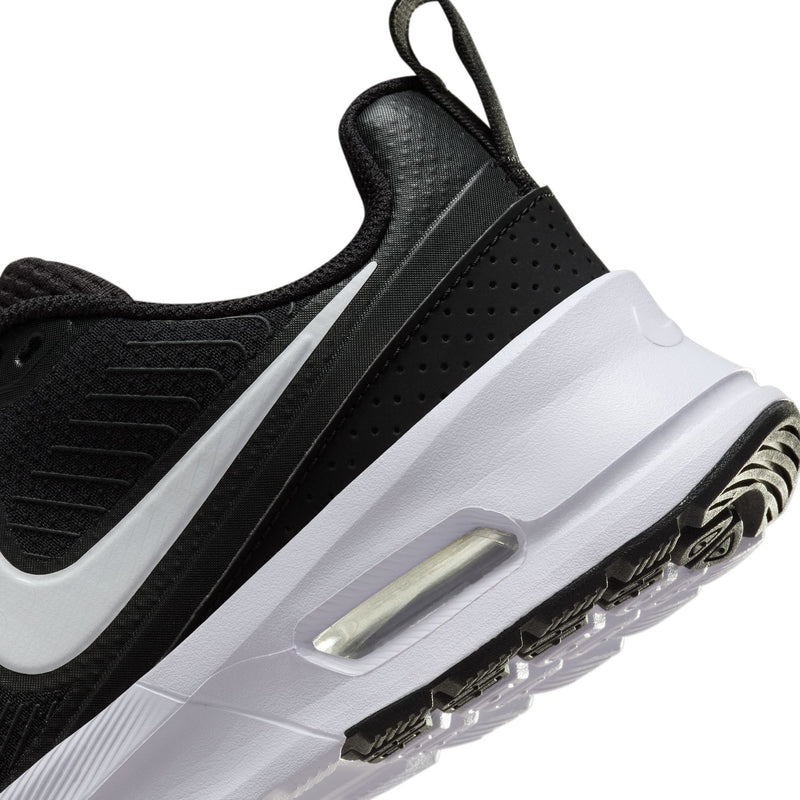 Side close-up of black Nike women's sneaker with Air window and outsole details