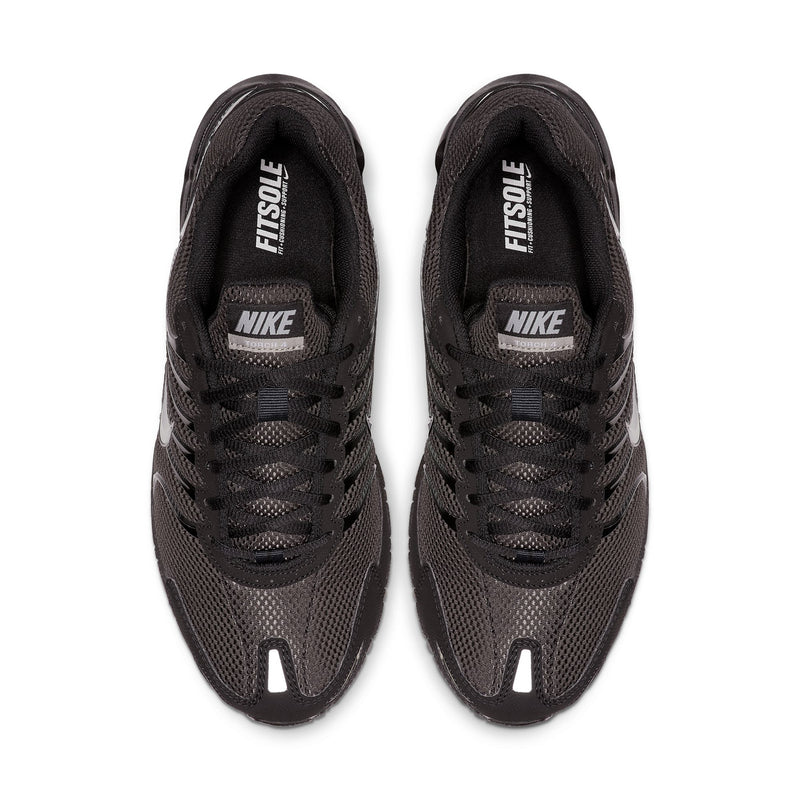 Pair of black Nike sneakers with 'FUSE' label on tongue and Nike logo on insole
