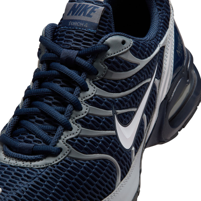 Nike Air Max Torch 4 close-up upper, navy laces, grey trim, and swoosh logo