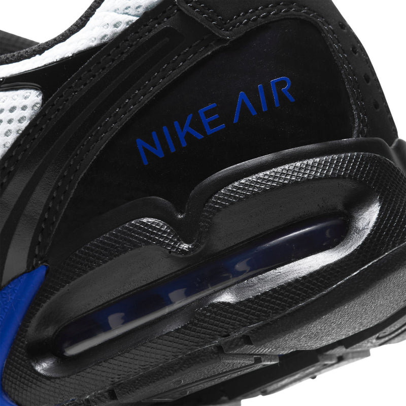 Men's running shoe close-up, black heel with NIKE AIR text and blue accents