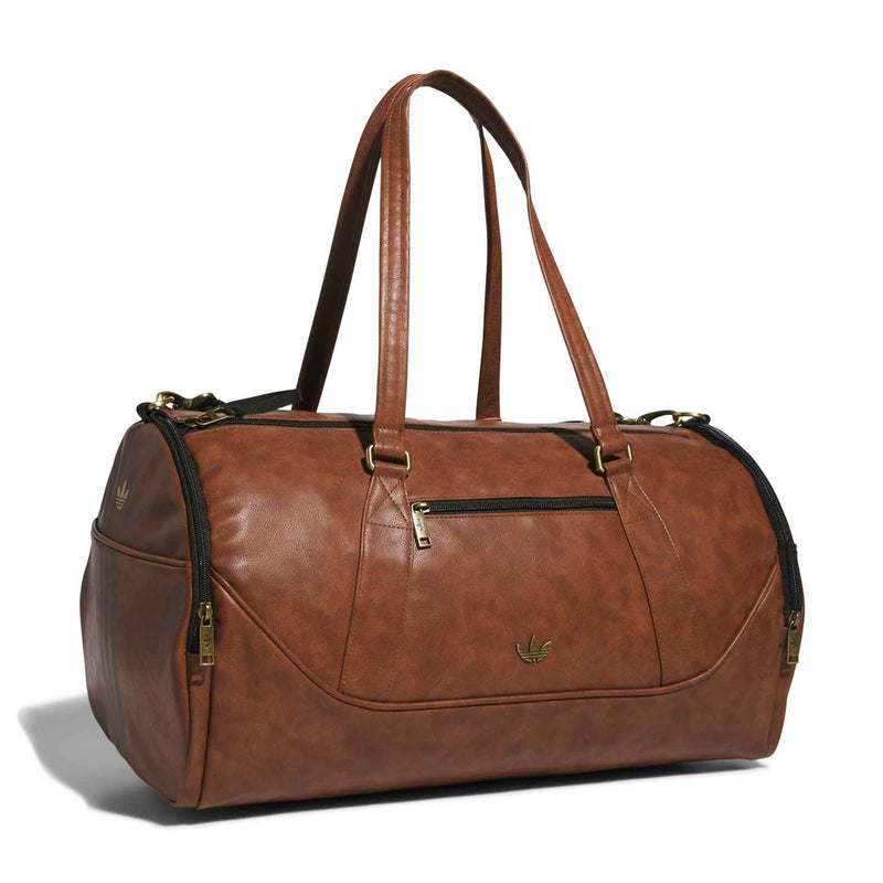 Brown duffel bag with top handles, front zipper pocket, and small logo patch