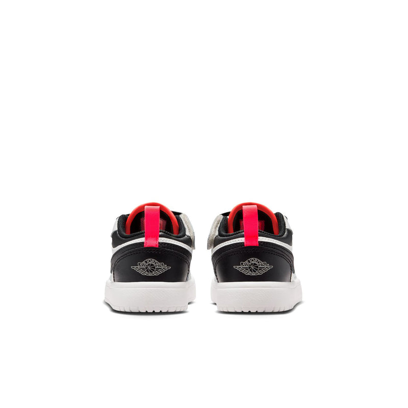 Kids low-top sneakers, back view with black heel collar and red pull tabs