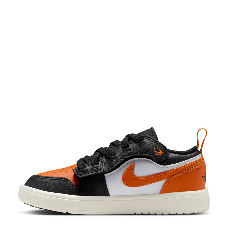 Kids low-top sneakers side view, black uppers with orange overlays and white panels