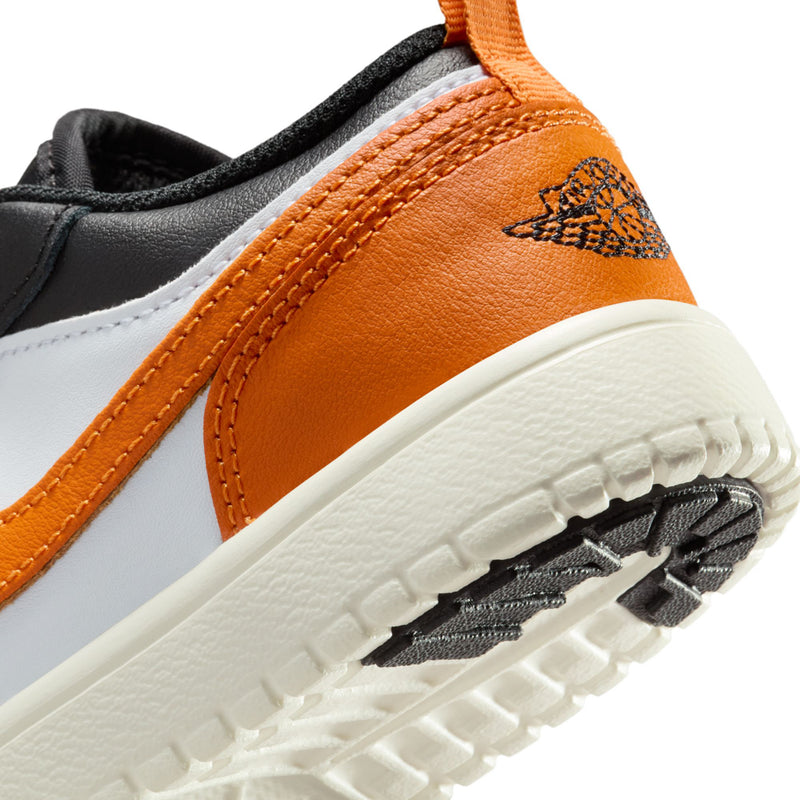 Kids low-top sneakers toe and sole detail, orange leather panel with black laces