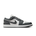 Low-top sneakers in dark gray and white with Nike Swoosh and lace-up design