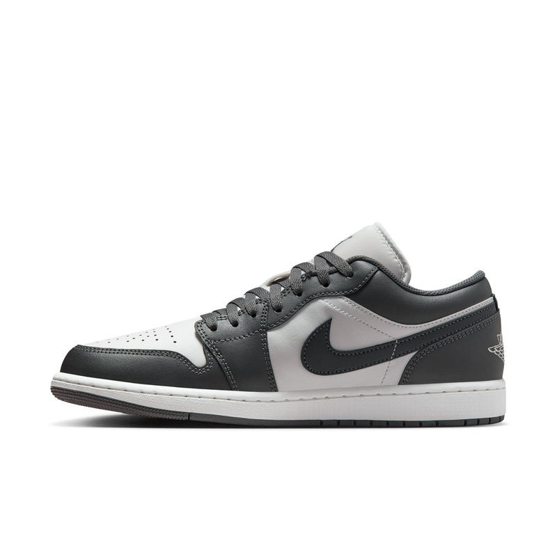 Low-top sneakers in dark gray and white with lace-up upper and side Swoosh