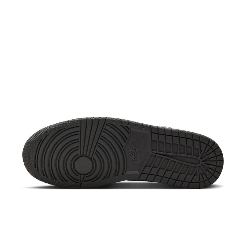 Shoe outsole for dark gray low-top sneakers with textured traction pattern
