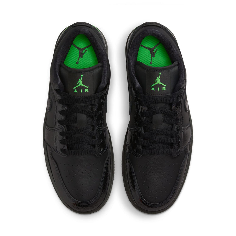 Black low-top sneakers with green insoles showing Air and Jumpman logos.