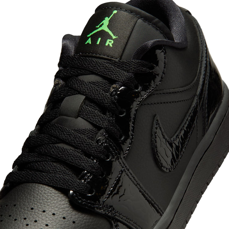 Black leather low-top sneaker with laces, Air branding, and Jumpman on collar.