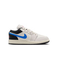 Youth low-top sneakers, white leather with blue Swoosh and black paneling, red accents