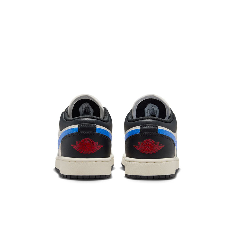 Youth low-top sneakers heel view, black and blue accents with red wing logo
