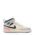 Kids AJ 1 Mid sneaker, white upper with black swoosh, pink panel, teal heel accents
