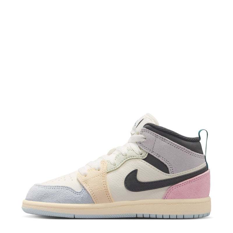 Kids AJ 1 Mid sneaker, side view with lace-up, black swoosh, pastel pink and gray overlays