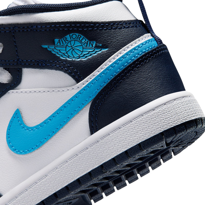 Close-up of kids' sneaker side with Air Jordan Wings logo and light-blue stripe