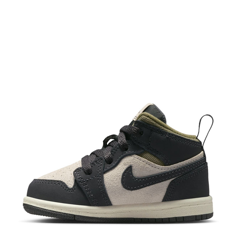 Toddler mid-top sneaker side view, black and off-white panels with olive collar lining