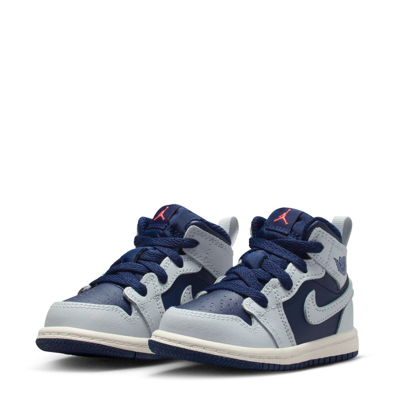 Pair of toddler mid-top sneakers in blue, white, and navy with lace-up closure