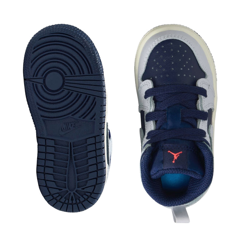 Toddler sneaker outsole and toe view in blue and white, lace-up, padded collar