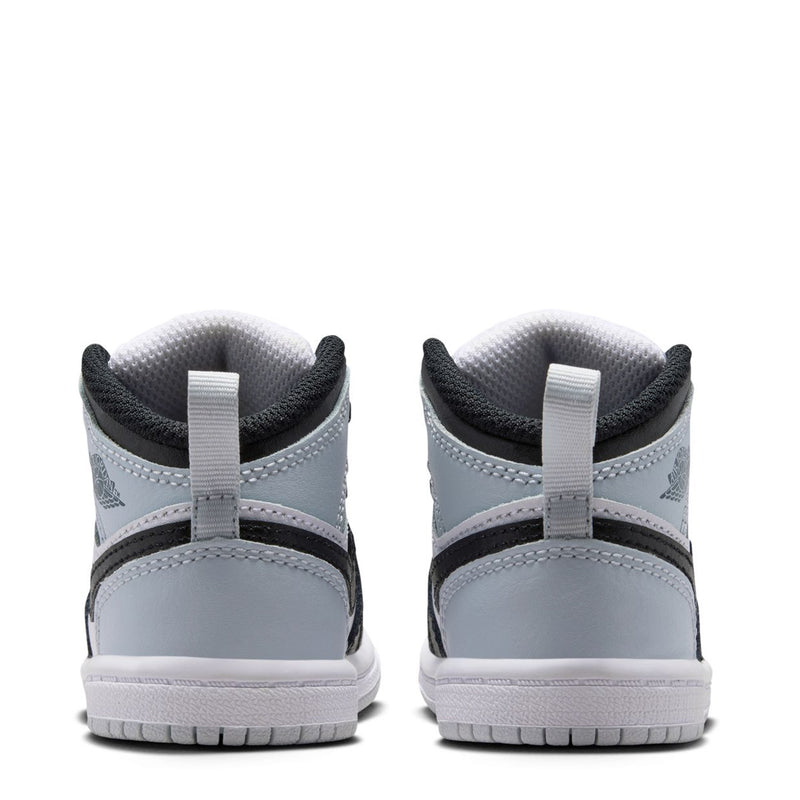 Toddler mid-top sneakers heel view in white and black with padded collar and loop tabs