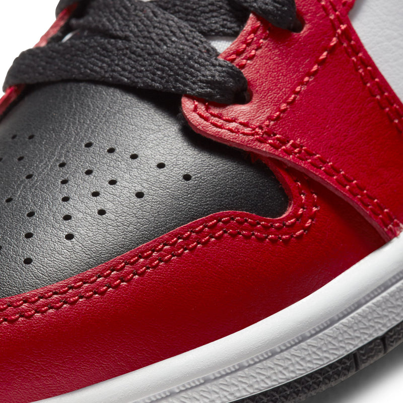 Kids Air Jordan 1 Mid close-up, red leather with perforations and black trim