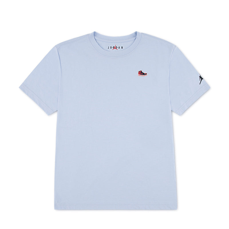 Youth light blue T-shirt with small Jordan sneaker patch on left chest